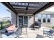 Covered patio with stylish seating, grill and a view of the backyard and garden at 981 Mound St, Bargersville, IN 46106