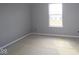 Bright bedroom features a window for natural light and neutral walls ready for personalization at 10609 Banyan Wood Ct, Indianapolis, IN 46239