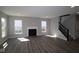 Cozy living room with a fireplace and large windows, perfect for relaxation at 10609 Banyan Wood Ct, Indianapolis, IN 46239