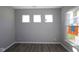 Well-lit room featuring three large windows, bright interior design at 10609 Banyan Wood Ct, Indianapolis, IN 46239