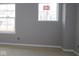 A bedroom featuring two windows offering natural light and a view of the neighborhood at 10609 Banyan Wood Ct, Indianapolis, IN 46239
