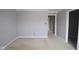 Empty room with fresh paint, baseboards, and multiple doorways at 10609 Banyan Wood Ct, Indianapolis, IN 46239