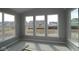 Bright room with three large windows showcasing the neighborhood view at 10609 Banyan Wood Ct, Indianapolis, IN 46239