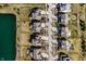 An aerial view of a residential neighborhood, showcasing tree-lined streets and a scenic pond at 12729 Brandenburg Dr, Carmel, IN 46032