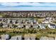 An aerial view of a well-planned residential community featuring manicured lawns and serene pond views at 12729 Brandenburg Dr, Carmel, IN 46032