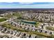 An aerial view shows a residential neighborhood with ponds, green spaces, and community features at 12729 Brandenburg Dr, Carmel, IN 46032