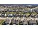 Expansive aerial shot of a community with diverse home styles, ample green space, and serene lakes at 12729 Brandenburg Dr, Carmel, IN 46032
