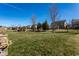 Expansive green backyard with mature trees and a serene atmosphere, ideal for outdoor recreation and relaxation under the open sky at 12729 Brandenburg Dr, Carmel, IN 46032