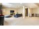 Large open finished basement with living and workspace areas and ample lighting at 12729 Brandenburg Dr, Carmel, IN 46032