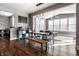 Bright dining room with modern lighting, wood floors, and view of living spaces at 12729 Brandenburg Dr, Carmel, IN 46032