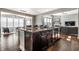 Spacious kitchen with stainless appliances, granite countertops, and open layout to dining and living areas at 12729 Brandenburg Dr, Carmel, IN 46032