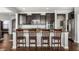 Open kitchen with granite countertops, stainless appliances, and breakfast bar with seating at 12729 Brandenburg Dr, Carmel, IN 46032