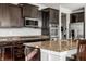 Beautiful kitchen with granite countertops, stainless appliances, and ample storage space at 12729 Brandenburg Dr, Carmel, IN 46032