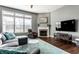 Comfortable living room with a fireplace, large windows, and stylish decor for relaxing at 12729 Brandenburg Dr, Carmel, IN 46032