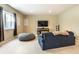 Finished basement living room with sofa, TV, and beanbag chair at 12729 Brandenburg Dr, Carmel, IN 46032