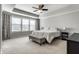 Spacious main bedroom with tray ceiling, ample natural light, and neutral carpeting at 12729 Brandenburg Dr, Carmel, IN 46032