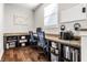 Dedicated home office with built-in desks, shelving, and a bright window at 12729 Brandenburg Dr, Carmel, IN 46032