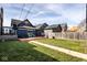 This backyard features a wood deck, green grass, partial view of neighboring buildings and a fence at 1334 E Market St, Indianapolis, IN 46202