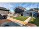 This backyard features a wood deck, green grass, partial view of neighboring buildings and a fence at 1334 E Market St, Indianapolis, IN 46202