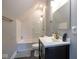 This bathroom features a tub with white subway tile and a modern vanity with a white countertop at 1334 E Market St, Indianapolis, IN 46202