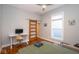 Comfortable bedroom with a ceiling fan, modern furniture, and wood flooring at 1334 E Market St, Indianapolis, IN 46202