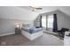 Cozy bedroom with slanted ceilings features a comfortable bed with built in drawers and natural light at 1334 E Market St, Indianapolis, IN 46202