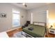 Cozy bedroom featuring a Murphy bed, window, chair and a nightstand with a lamp at 1334 E Market St, Indianapolis, IN 46202