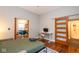 Bright bedroom featuring a pull-down Murphy bed, hardwood floors, and a convenient workstation at 1334 E Market St, Indianapolis, IN 46202