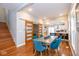 Spacious dining room with glass sliding doors opening to the kitchen and staircase to the side at 1334 E Market St, Indianapolis, IN 46202