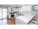 Elegant kitchen featuring white cabinets, stainless steel appliances, and a breakfast bar at 1334 E Market St, Indianapolis, IN 46202