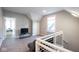 Upstairs living area featuring neutral walls, a small sofa, and lots of natural light at 1334 E Market St, Indianapolis, IN 46202