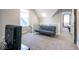 Inviting living area with carpeted floors, a modern sofa, and natural light streaming in at 1334 E Market St, Indianapolis, IN 46202