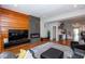 Modern living room with stylish fireplace, wood accent wall, open floor plan, and hardwood floors at 1334 E Market St, Indianapolis, IN 46202