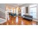 Bright and open-concept living space with wood floors, seamlessly connecting to the dining area and kitchen at 1334 E Market St, Indianapolis, IN 46202