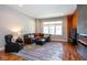 Comfortable living room features a fireplace, hardwood floors, and large windows at 1334 E Market St, Indianapolis, IN 46202