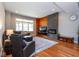 Stylish living room featuring a sleek fireplace, hardwood floors, and ample natural light at 1334 E Market St, Indianapolis, IN 46202