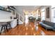 Bright and open-concept living space with wood floors, seamlessly connecting to the dining area and kitchen at 1334 E Market St, Indianapolis, IN 46202