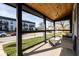 Inviting covered front porch with wood ceiling, seating and great curb appeal for relaxation at 1334 E Market St, Indianapolis, IN 46202