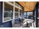 Inviting covered front porch with wood ceiling, seating and great curb appeal for relaxation at 1334 E Market St, Indianapolis, IN 46202