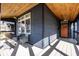 Inviting covered front porch with wood ceiling, seating and great curb appeal for relaxation at 1334 E Market St, Indianapolis, IN 46202