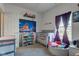 bedroom featuring a crib, Hogwarts themed decor, and natural light at 1360 Evergreen Dr, Greenfield, IN 46140