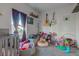 Bedroom featuring stuffed animals, guitar decor, and light wall colors at 1360 Evergreen Dr, Greenfield, IN 46140