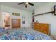 Bedroom featuring wood furnishings, light wall colors, and ceiling fan at 1360 Evergreen Dr, Greenfield, IN 46140