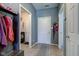 An inviting entryway with a coat rack, storage bench, and easy access to other rooms in the house at 1360 Evergreen Dr, Greenfield, IN 46140