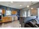 View of kitchen with stainless steel appliances, bar seating, and seamless access to the living room at 1360 Evergreen Dr, Greenfield, IN 46140