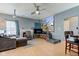 View of a cozy living room featuring a fireplace, comfortable seating, and a projector screen for movie nights at 1360 Evergreen Dr, Greenfield, IN 46140