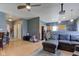 Comfortable living room features an open floor plan to the kitchen and ceiling fan at 1360 Evergreen Dr, Greenfield, IN 46140