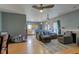 Inviting living room flows to the kitchen with a fireplace and open floor plan at 1360 Evergreen Dr, Greenfield, IN 46140