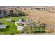 Sprawling land showing the residence, outbuildings, mature trees, and neighboring farmland at 139 W Jefferson St, Jamestown, IN 46147