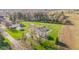 Expansive property featuring a well-maintained lawn, mature trees, and several outbuildings at 139 W Jefferson St, Jamestown, IN 46147
